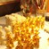 A cluster of candy giraffes next to unfinished white chocolate pieces on a table